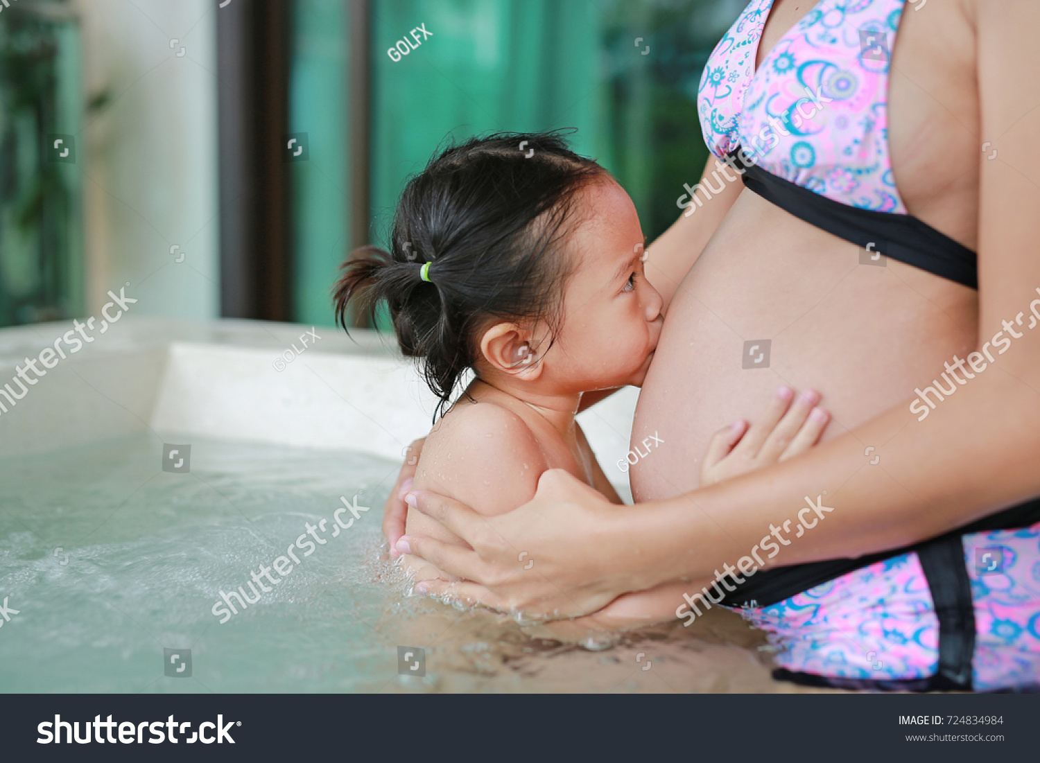 girls kissing in hot tub