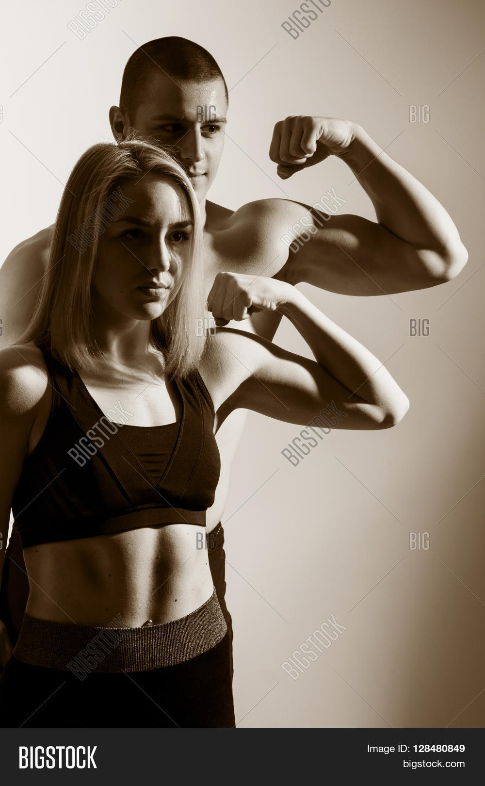 muscle girl flexing biceps