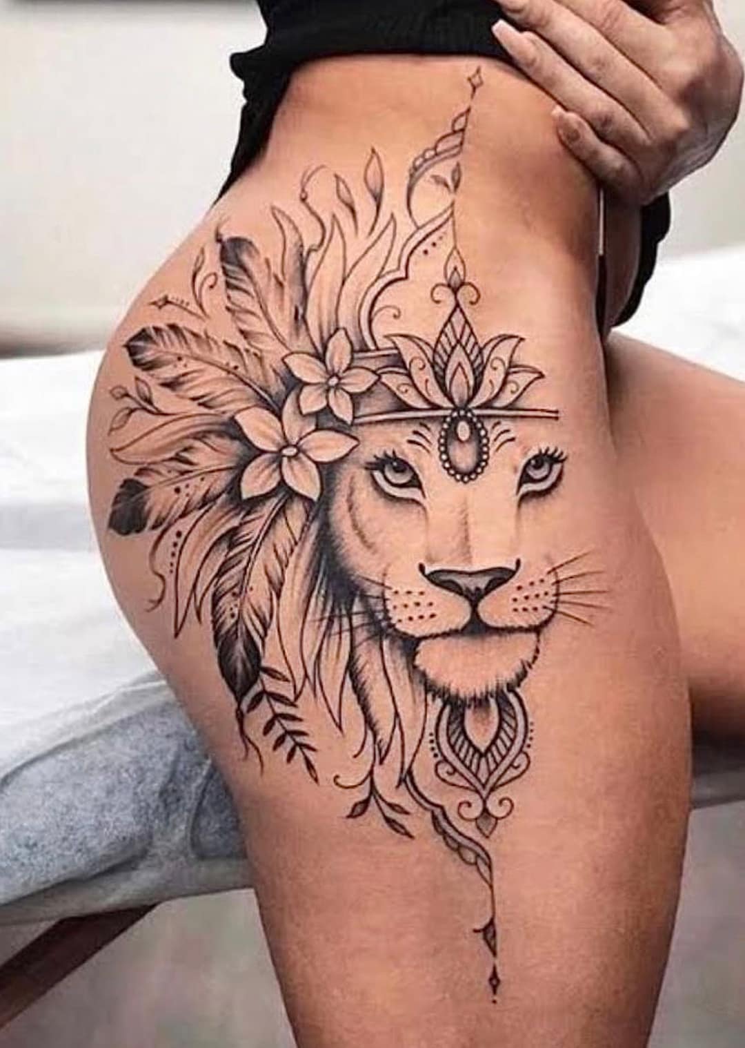 lion tattoo on thigh