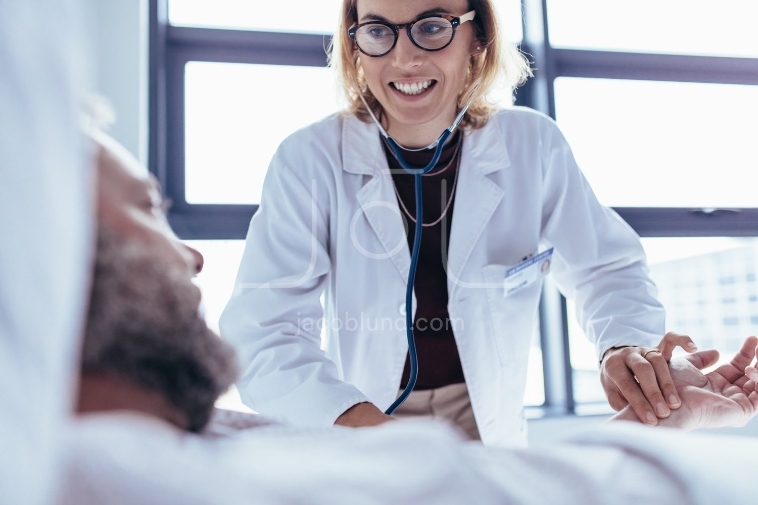 adam lugg add female doctor examining man photo