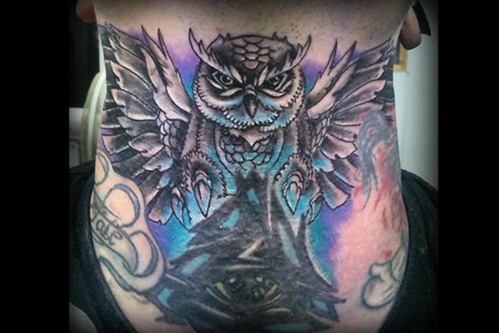 owl throat tattoo
